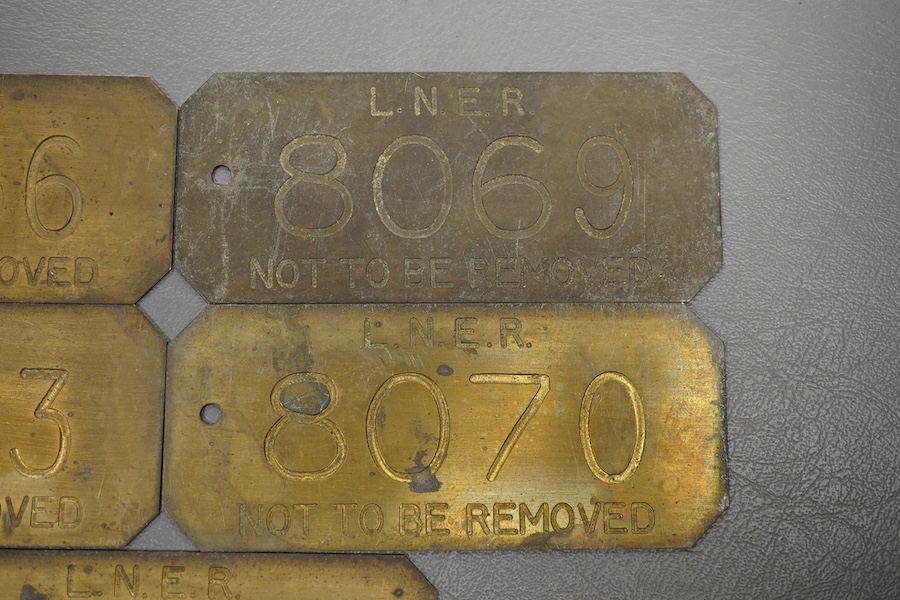 Five brass LNER engraved railway locomotive plates; ‘Not To Be Removed’, locomotive numbers; 8056, 8063, 8069, 8070, and 8072, each 11.8 x 5cm